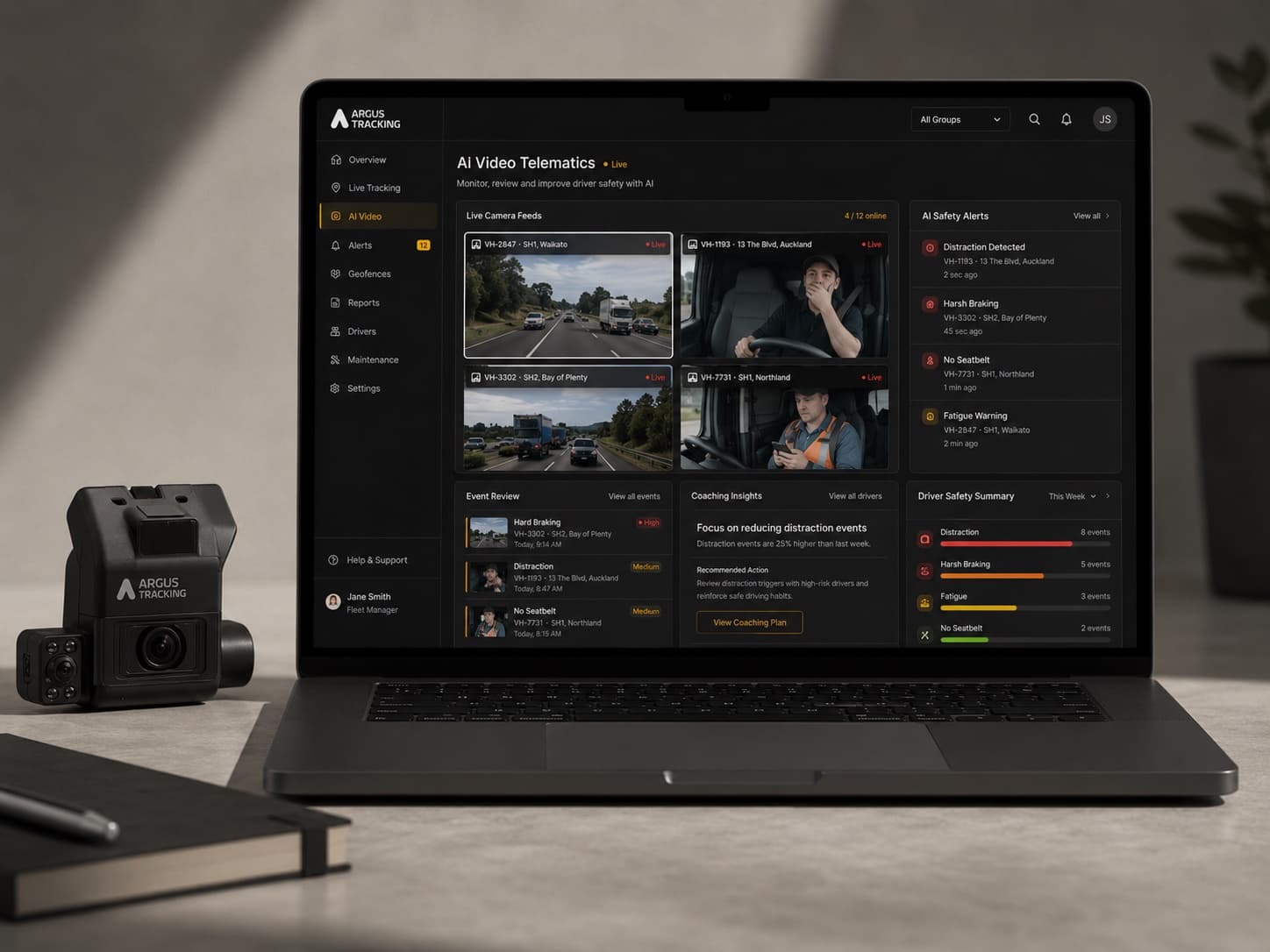 The Argus Vision AI Dashcam beside a laptop showing the AI Video Telematics dashboard