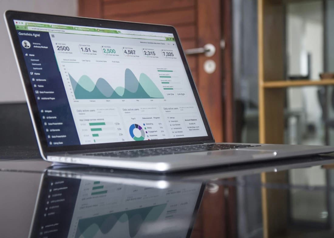 A fleet analytics dashboard on a laptop