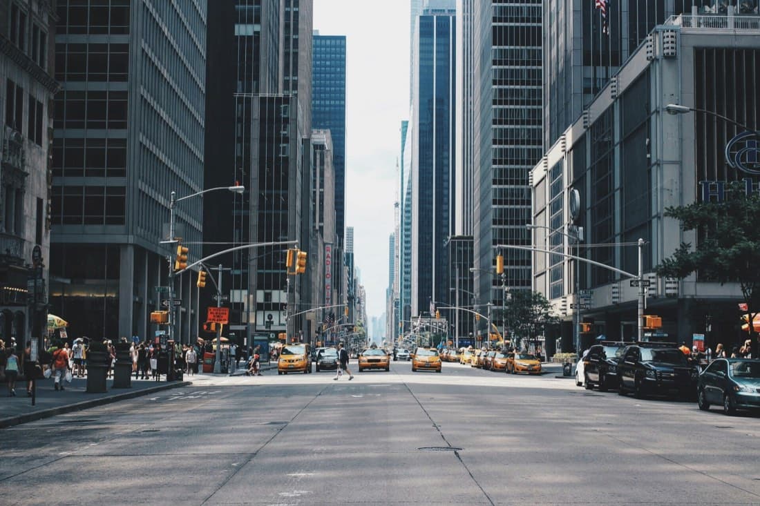 Vehicles moving through a city street